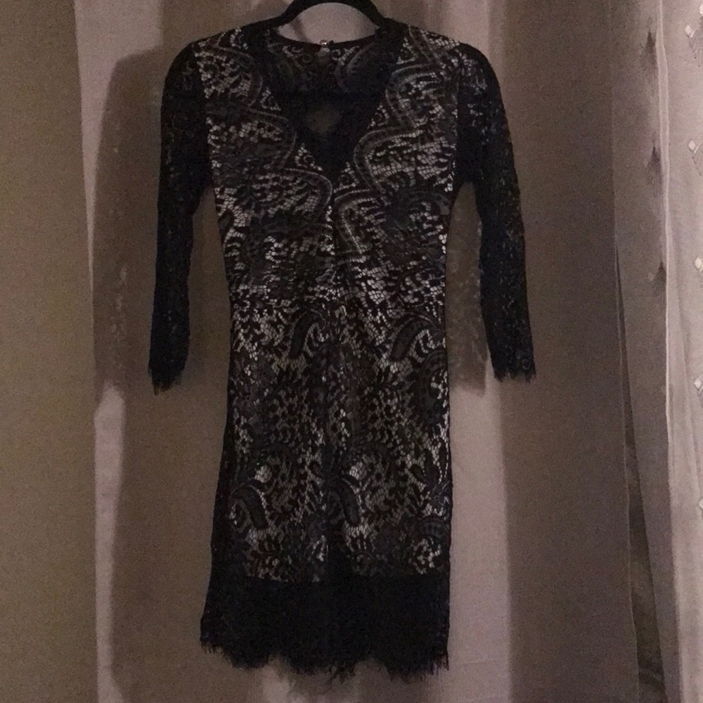 Beautiful lace never been worn mini dress.